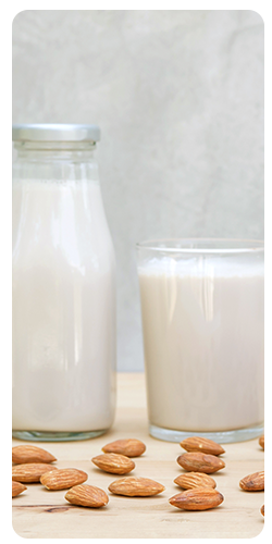 Bottle and glass of almond milk